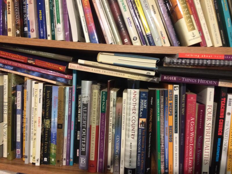 A bookshelf with many books.
